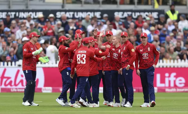 England players celebrate the wicket of West Indies' Evin Lewis during the second Men's International Twenty20 match at the Seat Unique Stadium, in Bristol, England, Sunday June 8, 2025. (Nigel French/PA via AP)