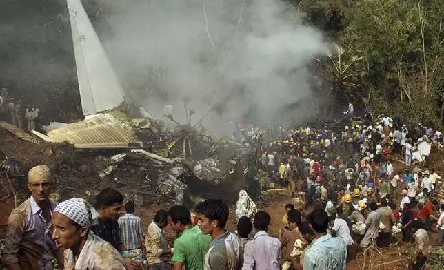 FILE- Rescuers work at the site of an Air India plane that crashed in Mangalore, in the southern Indian state of Karnataka, Saturday, May 22, 2010. (AP Photo)