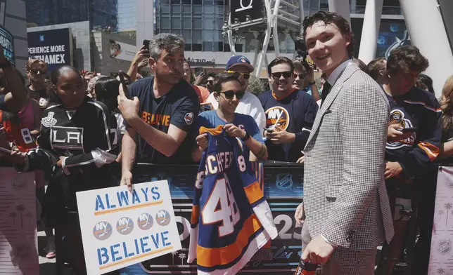 Matthew Schaefer walks the red carpet during the NHL hockey draft Friday, June 27, 2025, in Los Angeles. (AP Photo/Damian Dovarganes)