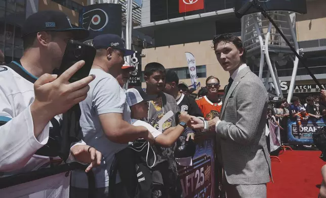 Matthew Schaefer walks the red carpet during the NHL hockey draft Friday, June 27, 2025, in Los Angeles. (AP Photo/Damian Dovarganes)