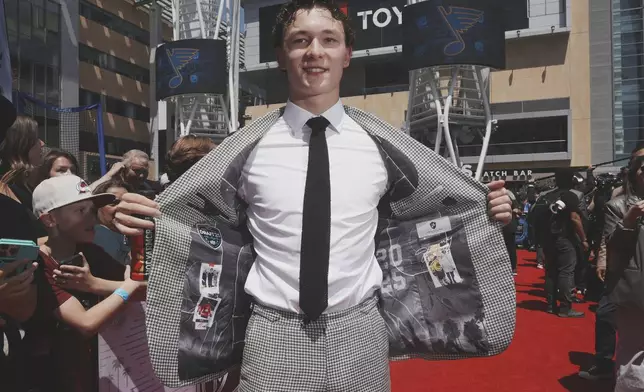 Matthew Schaefer walks the red carpet during the NHL hockey draft Friday, June 27, 2025, in Los Angeles. (AP Photo/Damian Dovarganes)