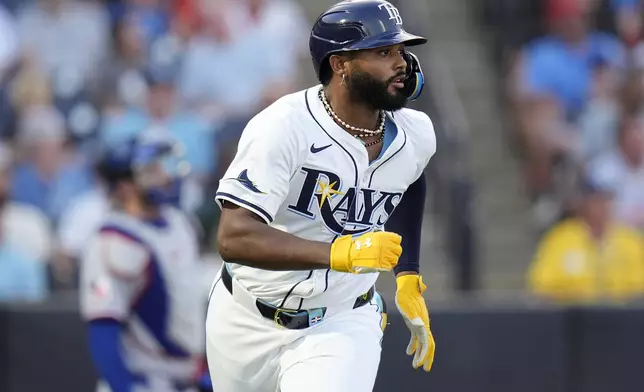 Tampa Bay Rays' Junior Caminero watches his home run off Texas Rangers pitcher Jack Leiter during the second inning of a baseball game Thursday, June 5, 2025, in Tampa, Fla. (AP Photo/Chris O'Meara)