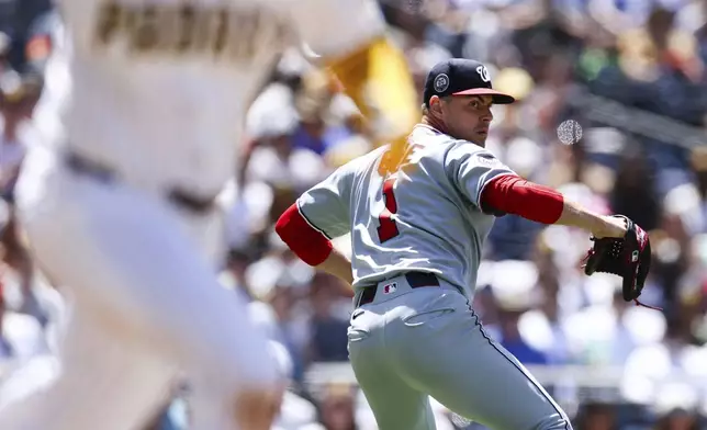 Washington Nationals' MacKenzie Gore, right, prepares to throw out San Diego Padres' Gavin Sheets at first base in the sixth inning of a baseball game, Wednesday, June 25, 2025, in San Diego. (AP Photo/Derrick Tuskan)