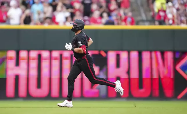 Cincinnati Reds' Spencer Steer rounds the bases after hitting a two-run home run during the fifth inning of a baseball game against the San Diego Padres, Friday, June 27, 2025, in Cincinnati. (AP Photo/Jeff Dean)