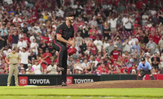 Cincinnati Reds pitcher Nick Martinez reacts after striking out San Diego Padres' Jake Cronenworth to retire the side during the eighth inning of a baseball game, Friday, June 27, 2025, in Cincinnati. (AP Photo/Jeff Dean)