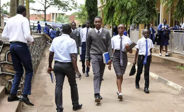 Students walk around the school compound at Uganda Martyrs' Secondary School Namugongo, in Kampala, Uganda Monday, May 26, 2025. (AP Photo/Hajarah Nalwadda)