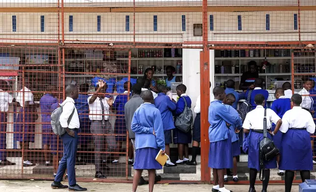 Students shop at the school canteen during lunch break at Uganda Martyrs' Secondary School Namugongo, in Kampala, Uganda Monday, May 26, 2025. (AP Photo/Hajarah Nalwadda)