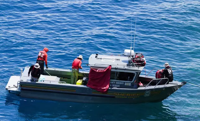 Washoe County Sheriffs conduct a search at D.L. Bliss State Park after a weekend incident in which a boat capsized, killing several people, on Monday, June 23, 2025, in Lake Tahoe, Calif. (AP Photo/Brooke Hess-Homeier)