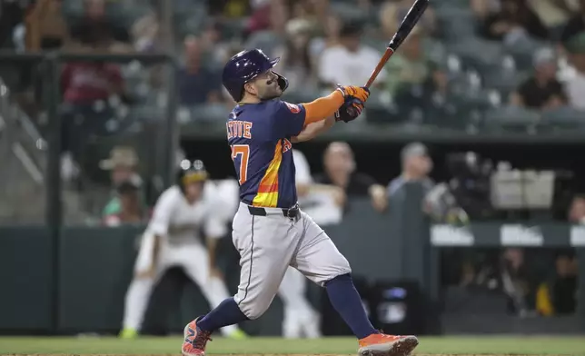 Houston Astros' Jose Altuve hits a three run home run against the Athletics during the sixth inning of a baseball game Wednesday, June 18, 2025, in West Sacramento, Calif. (AP Photo/Scott Marshall)