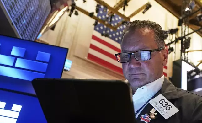 Trader Edward Curran works on the floor of the New York Stock Exchange, Friday, June 27, 2025. (AP Photo/Richard Drew)