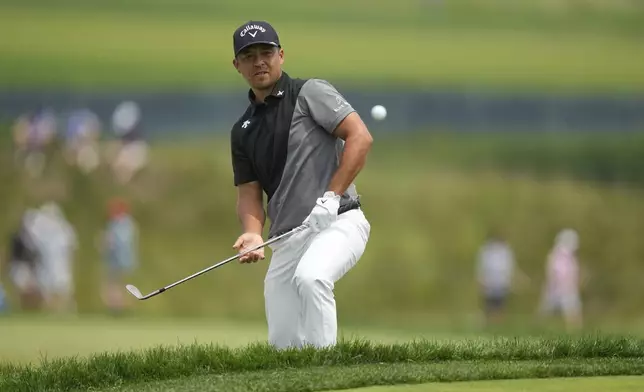 Xander Schauffele chips onto the 13th green during the second round of the U.S. Open golf tournament at Oakmont Country Club Friday, June 13, 2025, in Oakmont, Pa. (AP Photo/Seth Wenig)