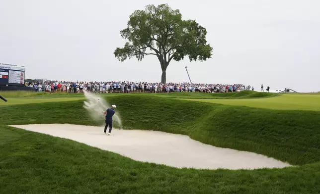 Viktor Hovland, of Norway, hits from a bunker on the second hole during the second round of the U.S. Open golf tournament at Oakmont Country Club Friday, June 13, 2025, in Oakmont, Pa. (AP Photo/Charlie Riedel)