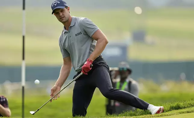 Thomas Detry, of Belgium, chips onto the fourth green during the second round of the U.S. Open golf tournament at Oakmont Country Club Friday, June 13, 2025, in Oakmont, Pa. (AP Photo/Carolyn Kaster)