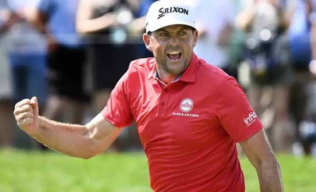 Keegan Bradley reacts to making birdie putt to a tie for the lead on the ninth hole during the final round of the Travelers Championship golf tournament at TPC River Highlands, Sunday, June 22, 2025, in Cromwell, Conn. (AP Photo/Jessica Hill)