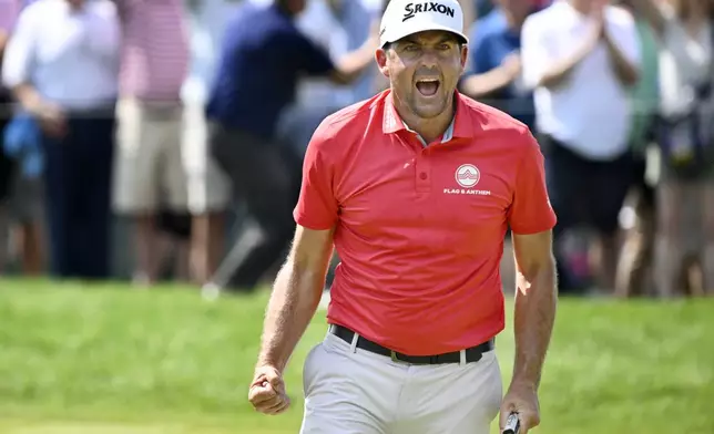 Keegan Bradley reacts to making birdie putt to a tie for the lead on the ninth hole during the final round of the Travelers Championship golf tournament at TPC River Highlands, Sunday, June 22, 2025, in Cromwell, Conn. (AP Photo/Jessica Hill)