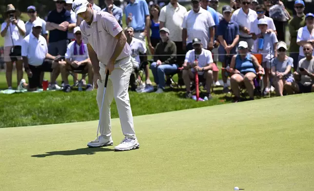 Russell Henley sinks a birdie on the first hole during the final round of the Travelers Championship golf tournament at TPC River Highlands, Sunday, June 22, 2025, in Cromwell, Conn. (AP Photo/Jessica Hill)