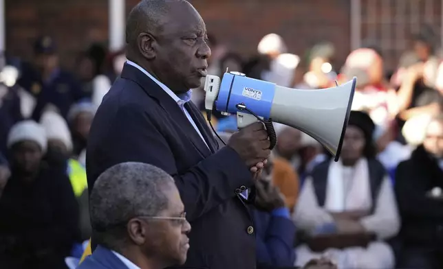 South African President Cyril Ramaphosa addresses victims of this week's floods in Mthatha, South Africa, Friday, June 13, 2025. (AP Photo/Themba Hadebe)
