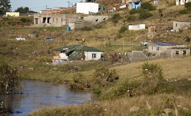 Homes sit damaged after floods swept through the area in Mthatha, South Africa, Thursday, June 12, 2025. (AP Photo/Themba Hadebe)