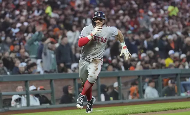 Boston Red Sox's Jarren Duran runs home to score against the San Francisco Giants during the fifth inning of a baseball game in San Francisco, Friday, June 20, 2025. (AP Photo/Jeff Chiu)
