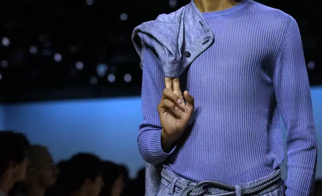 A model wears a creation as part of the men's Giorgio Armani Spring-Summer 2026 collection, that was presented in Milan, Italy, Monday, June 23, 2025. (AP Photo/Luca Bruno)