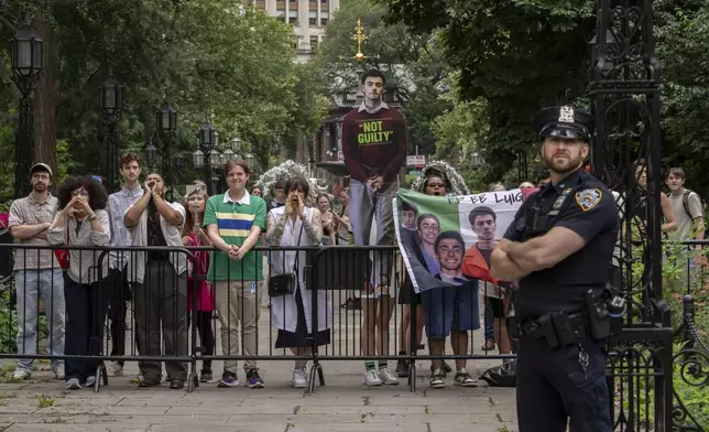Protesters shout as New York Mayor Eric Adams speaks during a campaign launch rally at City Hall, Thursday, June. 26, 2025, in New York. (AP Photo/Yuki Iwamura)