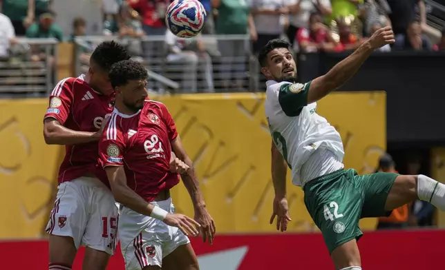 Al Ahly's Wessam Abou Ali, center, scors an own goal during the Club World Cup group A soccer match between Palmeiras and Al Ahly in East Rutherford, N.J., Thursday, June 19, 2025. (AP Photo/Seth Wenig)