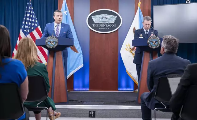 Defense Secretary Pete Hegseth and Joint Chiefs Chairman Gen. Dan Caine, right, take part in a news conference at the Pentagon, Thursday, June 26, 2025 in Washington. (AP Photo/Kevin Wolf)
