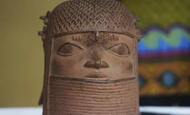 Benin bronzes looted in the past and returned to Nigeria are display during a handing over ceremony in Lagos Nigeria, Saturday, June 21, 2025. (AP Photo/Sunday Alamba)