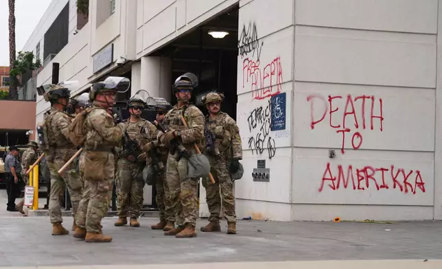 U.S. National Guard are deployed around downtown Los Angeles, Sunday, June 8, 2025, following a immigration raid protest the night before. (AP Photo/Eric Thayer)