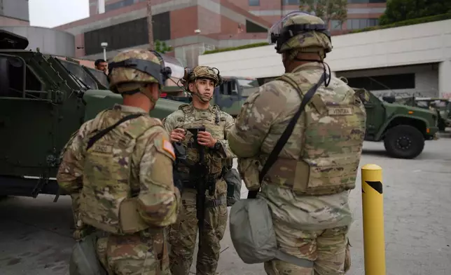 U.S. National Guard are deployed around downtown Los Angeles, Sunday, June 8, 2025, following an immigration raid protest the night before. (AP Photo/Eric Thayer)