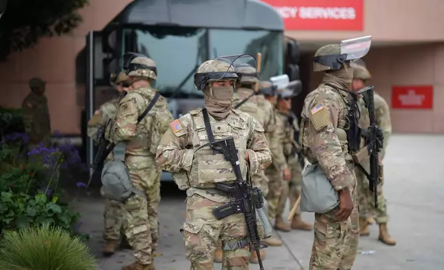 U.S. National Guard are deployed around downtown Los Angeles, Sunday, June 8, 2025, following an immigration raid protest the night before. (AP Photo/Eric Thayer)