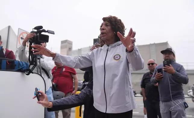 Congress Maxine Waters speaks to U.S. National Guard in downtown Los Angeles, Sunday, June 8, 2025, following last night's immigration raid protest. (AP Photo/Jae Hong)