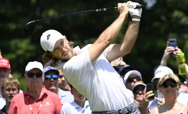 Tommy Fleetwood, from England, hits from the first tee during the final round of the Travelers Championship golf tournament at TPC River Highlands, Sunday, June 22, 2025, in Cromwell, Conn. (AP Photo/Jessica Hill)
