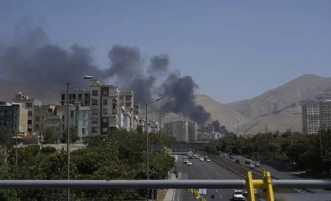 Smoke rises from an oil storage facility after it appeared to have been struck by an Israeli strike on Saturday, in Tehran, Iran, Monday, June 16, 2025. (AP Photo/Vahid Salemi)(AP Photo/Vahid Salemi)