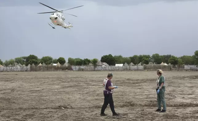 Medical staff with the International Committee of the Red Cross (ICRC), wait for weapon-wounded patients in Akobo, South Sudan, Saturday, May 24, 2025. (AP Photo/Joseph Falzetta)