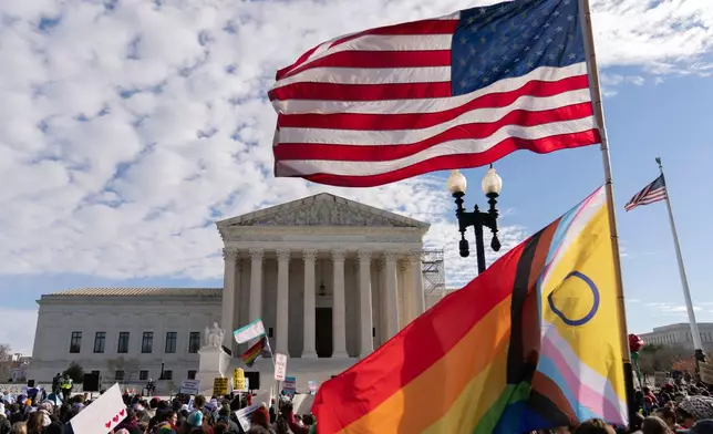 FILE - Transgender rights supporters rally outside of the Supreme Court, Wednesday, Dec. 4, 2024, in Washington. (AP Photo/Jose Luis Magana, File)