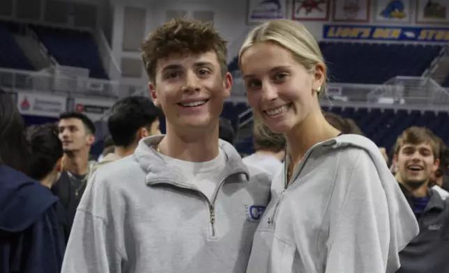 Twin siblings Liam Heaney, left, and Emma Heaney attend rehearsal for Plainview-Old Bethpage John F. Kennedy High School's graduation ceremony at Hofstra University in Hempstead, N.Y., on Tuesday, June 17, 2025. (AP Photo/Philip Marcelo)