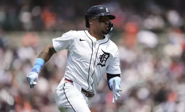Detroit Tigers' Javier Báez runs out a double against the Cincinnati Reds in the seventh inning during a baseball game, Sunday, June 15, 2025, in Detroit. (AP Photo/Paul Sancya)