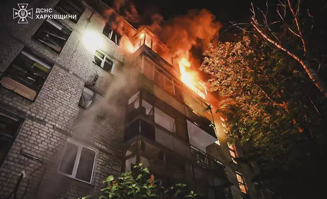 In this photo provided by the Ukrainian Emergency Service, a view after a Russian attack that hit a residential building in Kharkiv, Ukraine, Wednesday, June 11, 2025. (Ukrainian Emergency Service via AP)