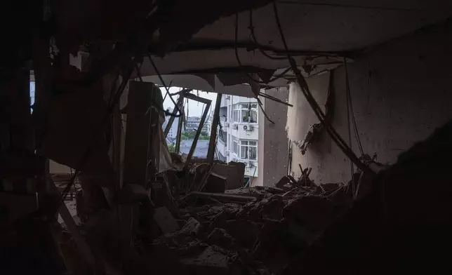 An apartment of a residential multi-storey building is seen damaged after a Russian drone strike on Kyiv, Ukraine, on Friday, June 6, 2025. (AP Photo/Evgeniy Maloletka)