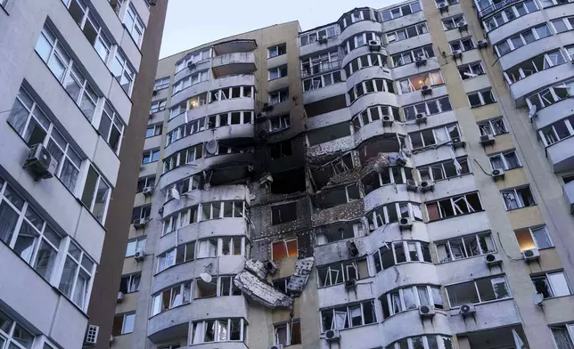 A residential multi-storey building is seen damaged after a Russian drone strike on Kyiv, Ukraine, on Friday, June 6, 2025. (AP Photo/Evgeniy Maloletka)