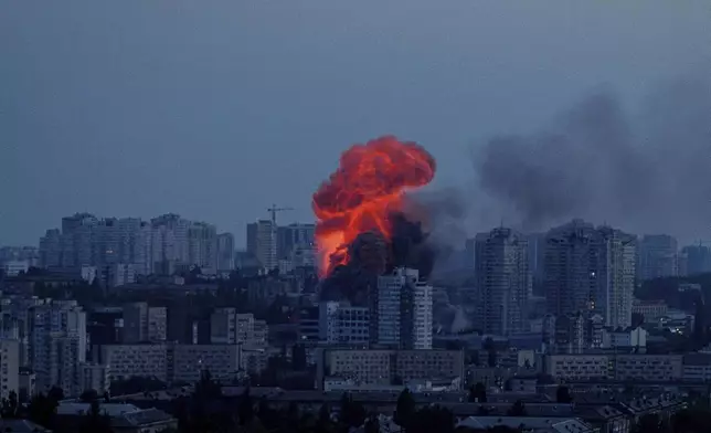 Explosion is seen after Russian air strike on Kyiv, Ukraine, on Friday, June 6, 2025. (AP Photo/Evgeniy Maloletka)