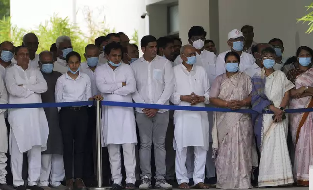 Political leaders gather to pay respect to the body of former Chief Minister of Gujarat Vijay Rupani, victim of Thursday's Air India plane crash, at a hospital in Ahmedabad, India, Monday, June 16, 2025. (AP Photo/Ajit Solanki)