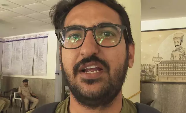 In this image taken from a video, Navin Chaudhary, a doctor who witnessed Thursday's Air India plane crash, speaks to The Associated Press in Ahmedabad, India, Monday, June 16, 2025. (AP Photo/Shonal Ganguly)