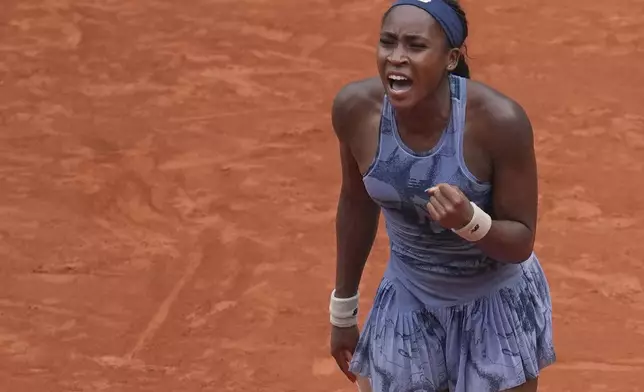 Coco Gauff of the U.S. celebrates beating Marie Bouzkova of the Czech Republic during their third round match of the French Tennis Open, at the Roland-Garros stadium, in Paris, Saturday, May 31, 2025. (AP Photo/Christophe Ena)