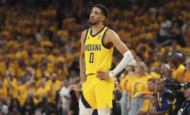 Indiana Pacers guard Tyrese Haliburton watches during the second half of Game 4 of the NBA Finals basketball series against the Oklahoma City Thunder, Friday, June 13, 2025, in Indianapolis. (AP Photo/Michael Conroy)