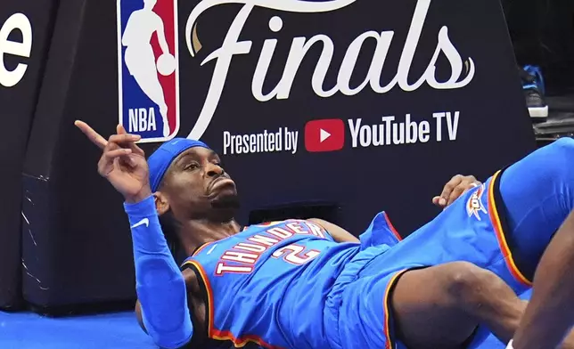 Oklahoma City Thunder guard Shai Gilgeous-Alexander (2) questions a call during the second half of Game 2 of the NBA Finals basketball series against the Indiana Pacers Sunday, June 8, 2025, in Oklahoma City. (AP Photo/Julio Cortez)