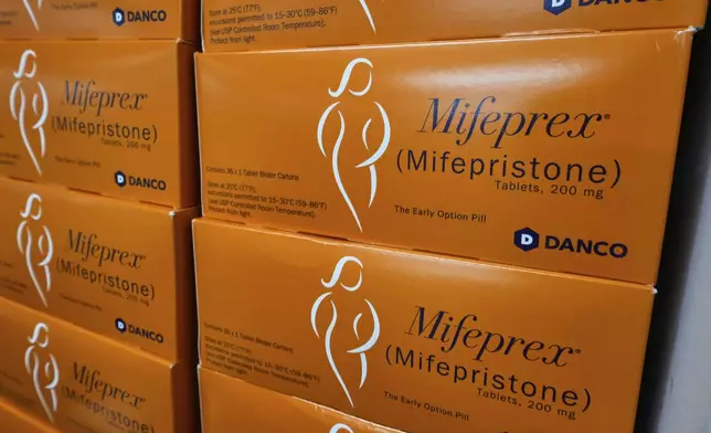 Boxes of Mifeprex, which will be sent out to clients, are stacked at the Massachusetts Medication Abortion Access Project, May 13, 2025, in Somerville, Mass. (AP Photo/Charles Krupa)