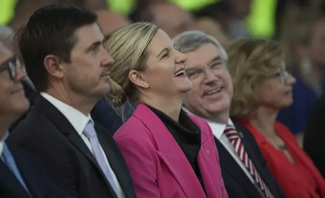President-elect Kirsty Coventry, center, attends the handover ceremony of the IOC Presidency at Olympic House in Lausanne, Switzerland, Monday, June 23, 2025. (AP Photo/Laurent Cipriani)