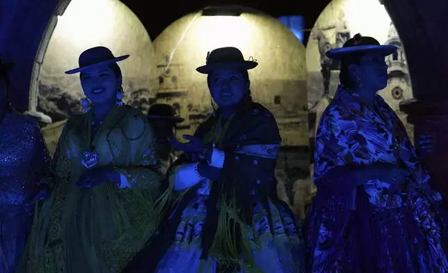 Women compete in the Miss Cholita Pacena beauty pageant, an annual contest aiming to recognize Aymara Indigenous women's fashion and beauty, as well as their command of the Indigenous lifestyle and language, in La Paz, Bolivia, Friday, June 27, 2025. (AP Photo/Juan Karita)